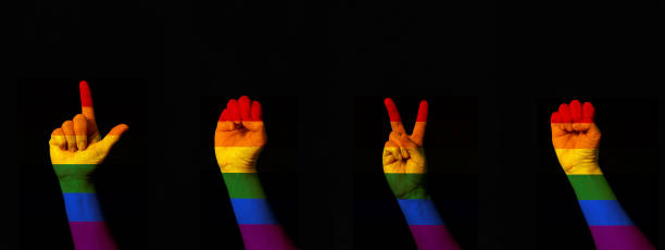 Word Love made with hand gesturing international sign language rainbow flag gay pride on black background Word Love made with hand gesturing international sign language rainbow flag gay pride on black background International Day of Sign Languages stock pictures, royalty-free photos & images