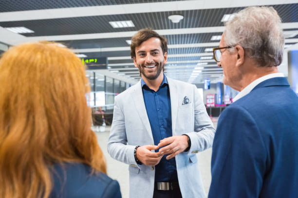 istock Business colleagues discussing at airport 1318937821