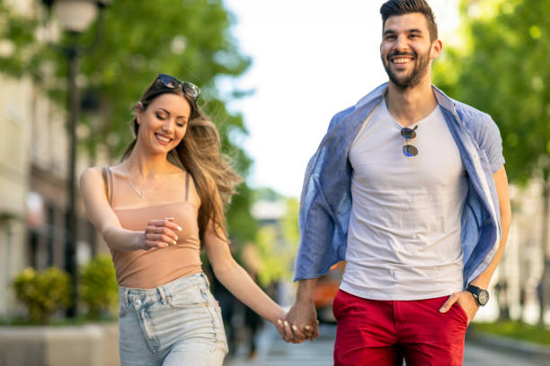 istock Happy young couple outdoors on sunny day 1318938855