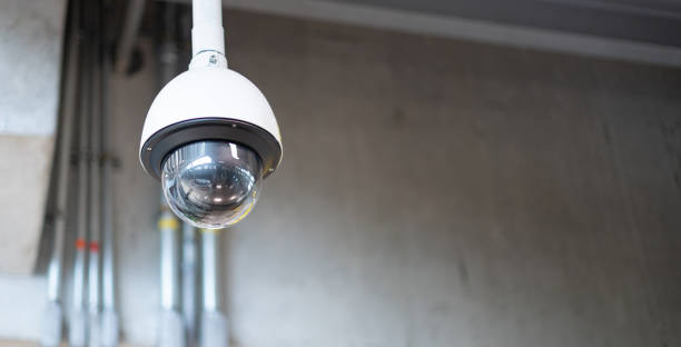 istock The CCTV Security camera hang on the ceiling for survey and protect criminal for safety people in the parking car building at the airport. 1318941774
