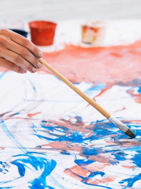 istock art hobby artist hand painting abstract artwork 1318947945