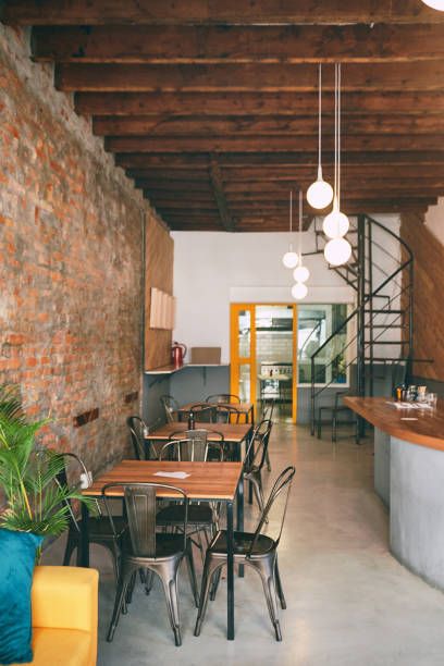istock Shot of tables and chairs in an empty cafe 1318949264