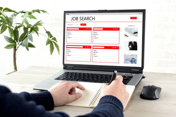 istock Man's hands making use of job serch web site 1318950729