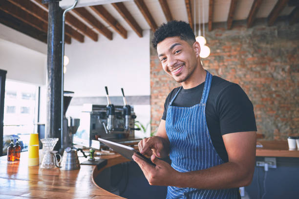 istock Shot of a confident young man using a digital tablet while working in a cafe 1318951627