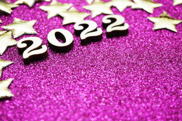 istock Happy New year 2022 with space copy on purple glitter background 1318954529