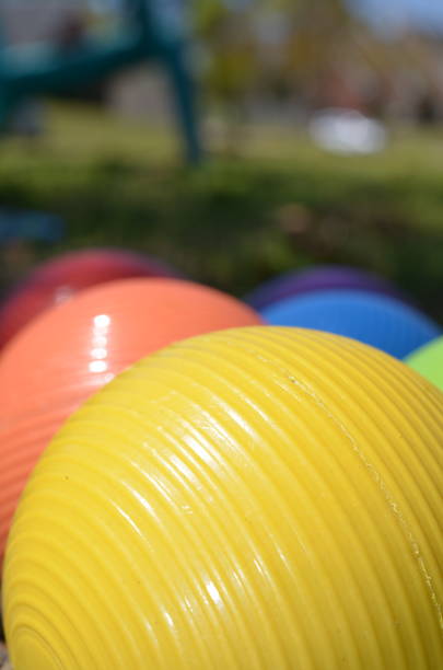 istock Bright rainbow colored croquet balls close up 1318955365