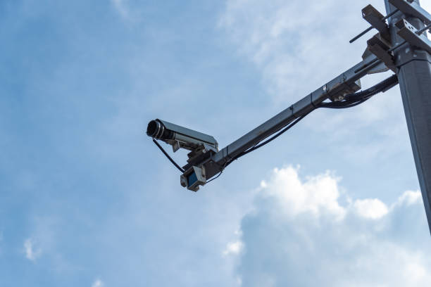 street speed camera on the road against the background of the sky. - rules of the road imagens e fotografias de stock