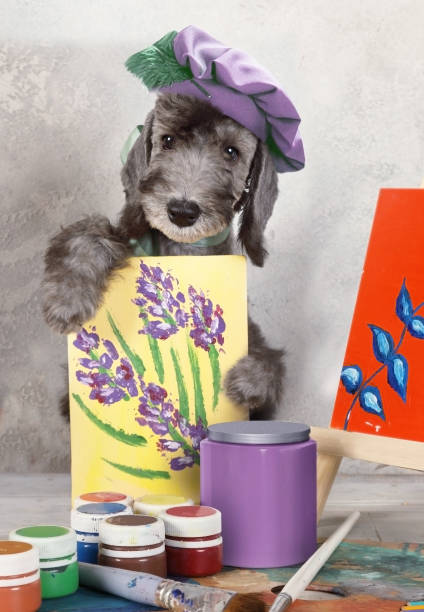 istock Funny artist  Bedlington puppy in the workshop 1318968043