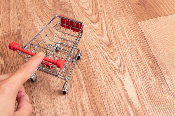 istock Small decorative cart on a wooden background 1318977711