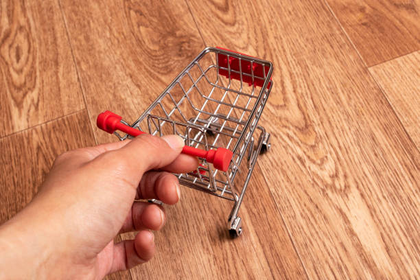 istock Small decorative cart on a wooden background 1318977722