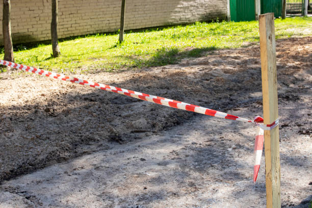 istock Red and white safety tape in the park 1318977878