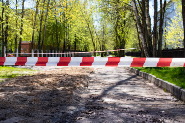 istock Red and white safety tape in the park 1318977908