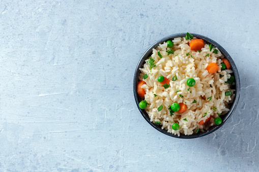 Rice with vegetables, shot from above with copyspace
