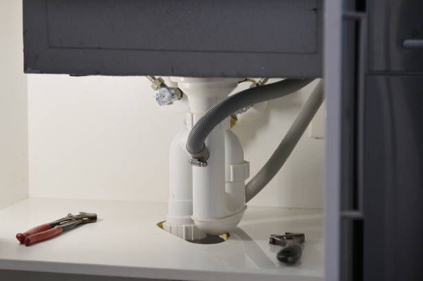 istock Plumber working tools fixing and repairing a kitchen faucet tap leaking 1318979203