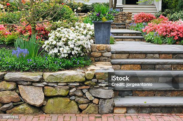 Stone Wall Steps And Planter On Colorful Garden Stock Photo - Download Image Now - Yard - Grounds, Landscaped, Stone - Object