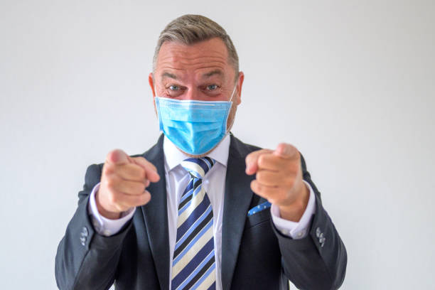 istock Businessman pointing fingers on both hands at the camera 1318980455