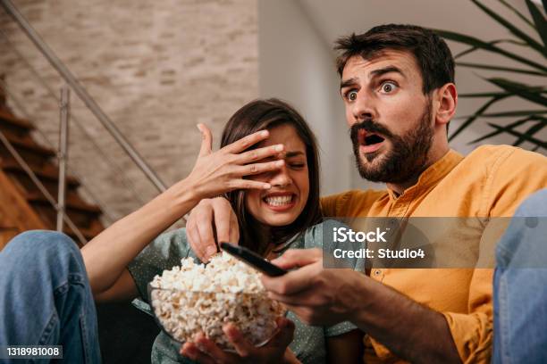 Couple Watching Horror Movie Stock Photo - Download Image Now - Horror Movie, Watching, Television Set