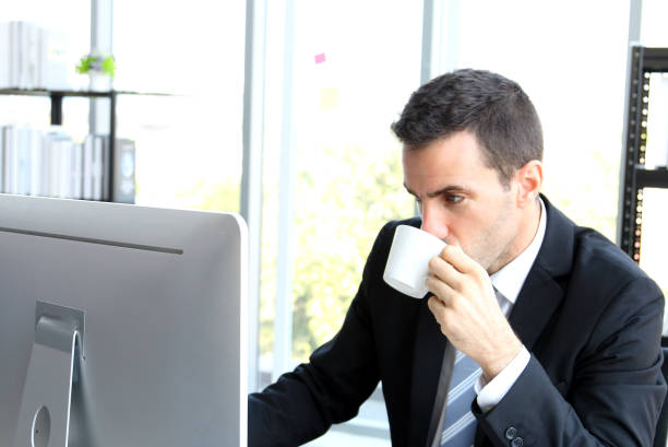 istock businessman drink coffee 1318981969