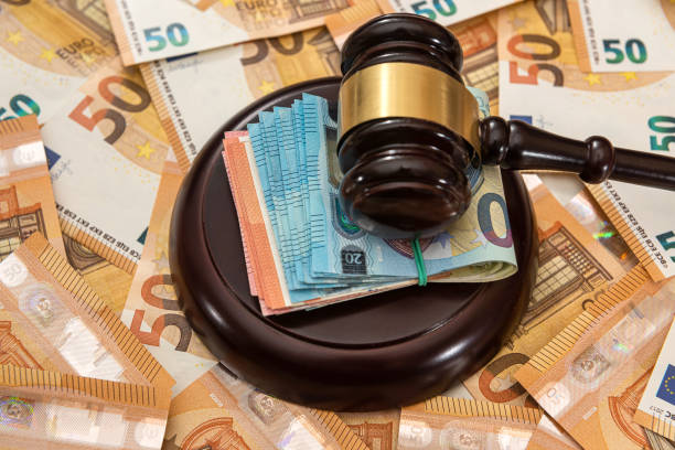 istock hammer and many 50 euro bills 1318984448