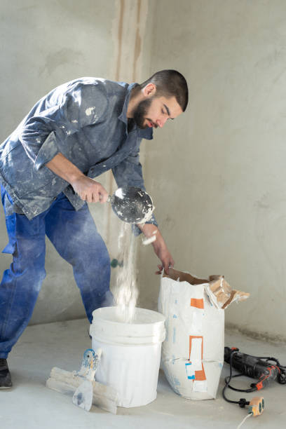 istock The worker mixes the solution in the bucket 1318988653