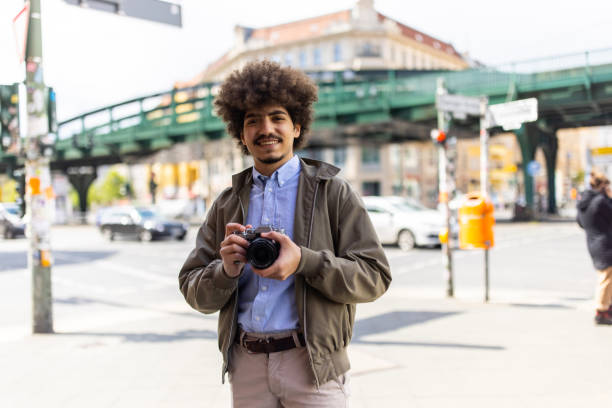 istock Middle eastern tourist in Berlin with his photo camera 1318992776