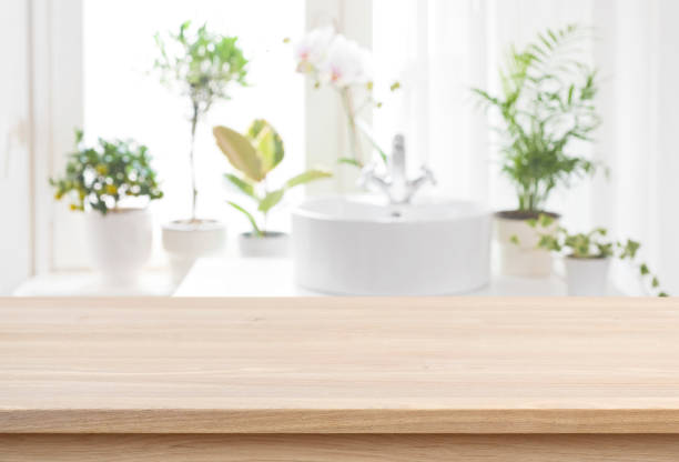 istock Blank tabletop for product display with blurred bathroom sink background 1318992803