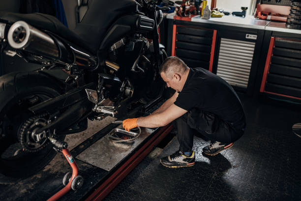 istock Male mechanic repairing motorcycle 1318994543