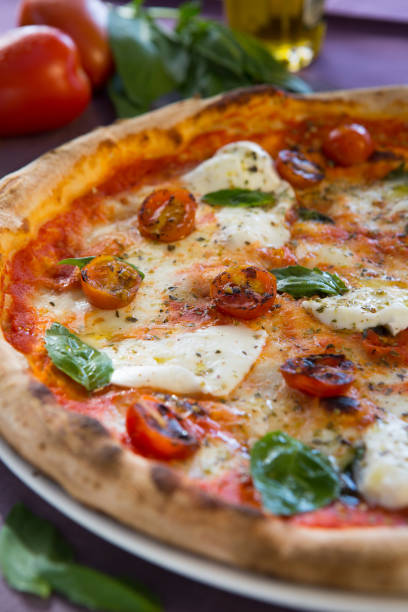istock close shots of different types of pizza 1318994544