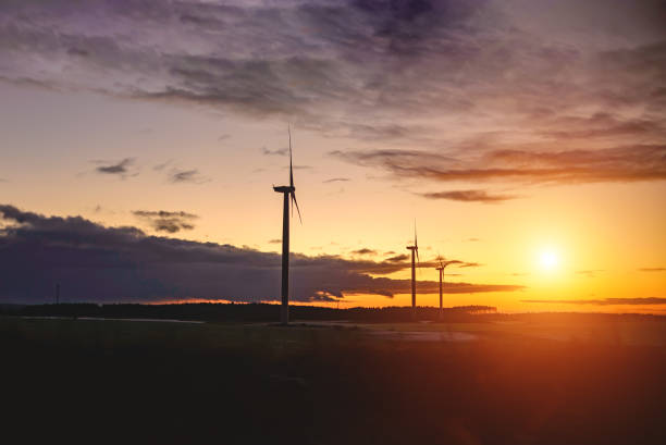 istock Wind power plants in sunlight in winter time. Toning 1318994628