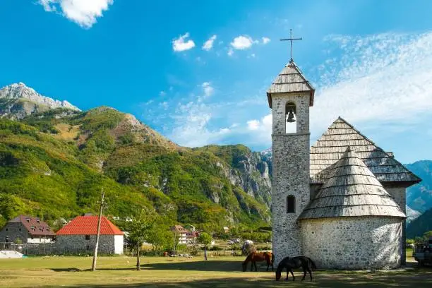 beautiful views of the church in Theth village and the surrounding mountains. Theth National Park, Albania. The theme is nature, travel, exploring, Europe, Albania, Balkan, national parks, hiking