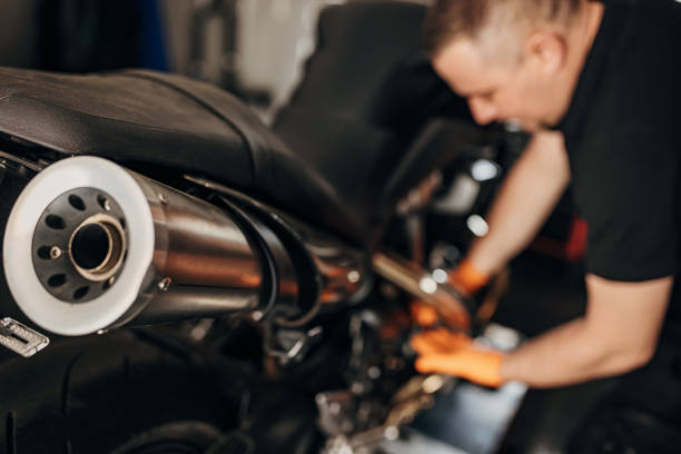 istock Male mechanic repairing motorcycle 1318995569