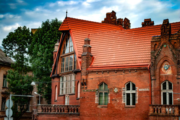 19th orange brick house in lviv, ukraine. neo-romantic style house was built in 1889 - styka imagens e fotografias de stock