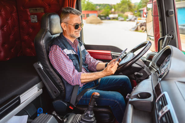 istock Mature truck driver using a mobile app 1318999584