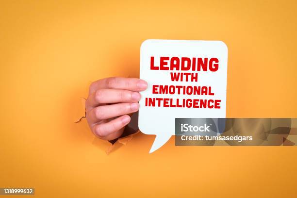 Leading With Emotional Intelligence Speech Bubble In Woman Hand Stock Photo - Download Image Now