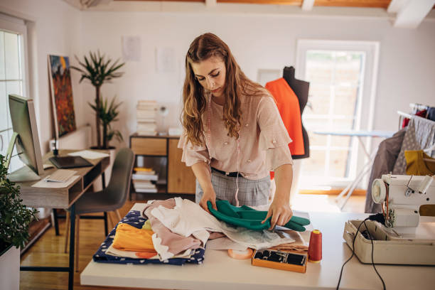 istock Female fashion designer in her workshop 1319000630