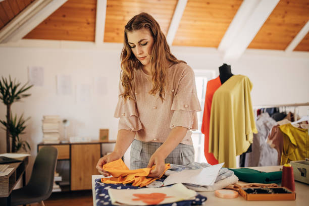 istock Female fashion designer in her workshop 1319000703