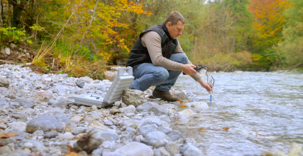 istock Male biologist testing the oxygen levels in the river 1319000737