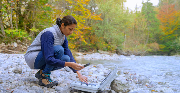istock Female biologist measure water content with digital device 1319000763
