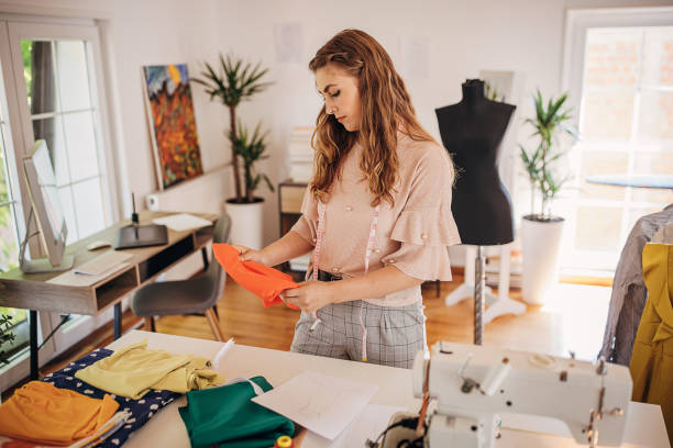 istock Female fashion designer in her workshop 1319000803