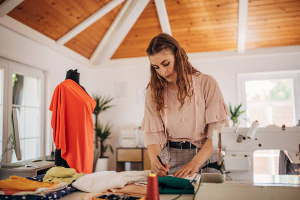 istock Female fashion designer in her workshop 1319001770
