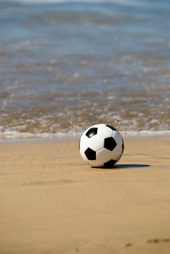 Soccer ball at the beach