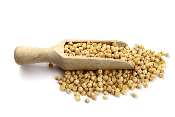 istock dried peas in wooden scoop isolated on white background 1319003985