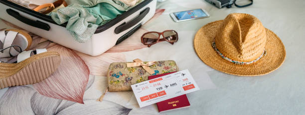 istock Unrecognizable woman preparing suitcase for summer holidays 1319004942