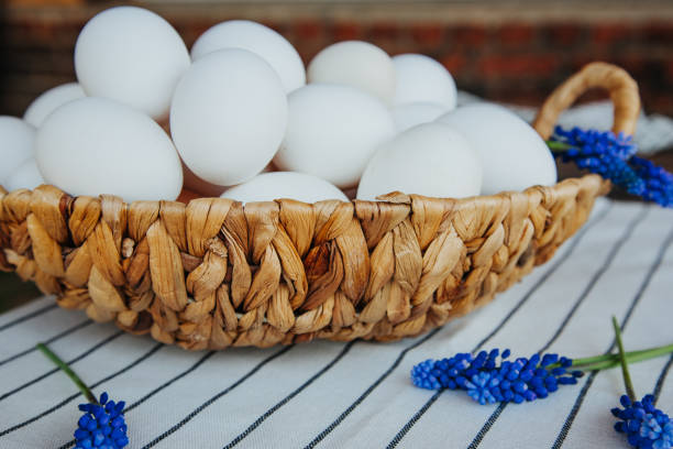 istock white eggs on striped tablecloths and blue muskari flowers 1319005275