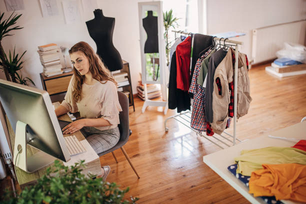 istock Female fashion designer working on computer 1319007677