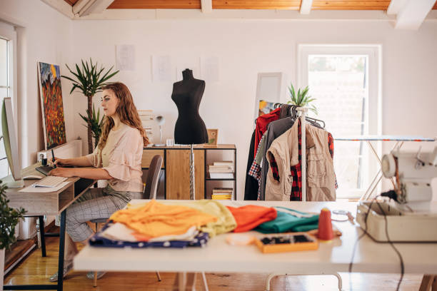 istock Female fashion designer working on computer 1319007700