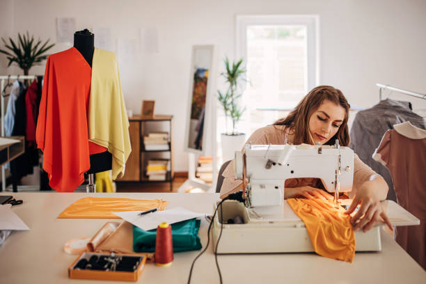 istock Female fashion designer sewing 1319009125