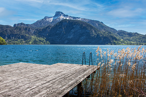 The Salzkammergut is one of the most important tourist regions of Austria. It is the European Capital of Culture 2024. View from a bathing place  to the Schafberg in the back.