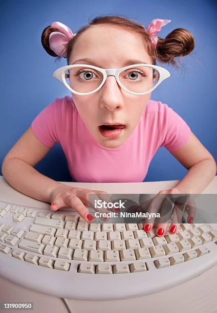 Nerdy Girl With Computer Keyboard Stock Photo - Download Image Now - Adolescence, Adult, Alertness