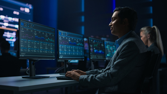 Confident Male Data Scientist Works On Personal Computer In Big ...